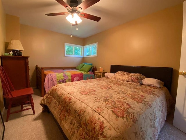 bedroom featuring ceiling fan and light colored carpet