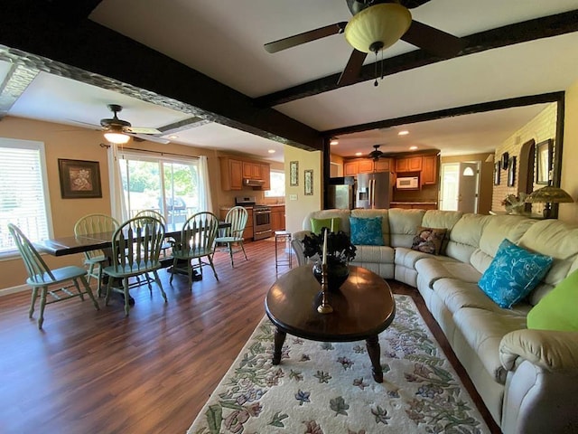 living room featuring hardwood / wood-style floors, ceiling fan, and beamed ceiling