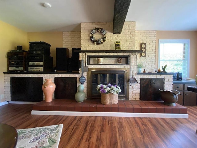 living room with a fireplace and hardwood / wood-style flooring