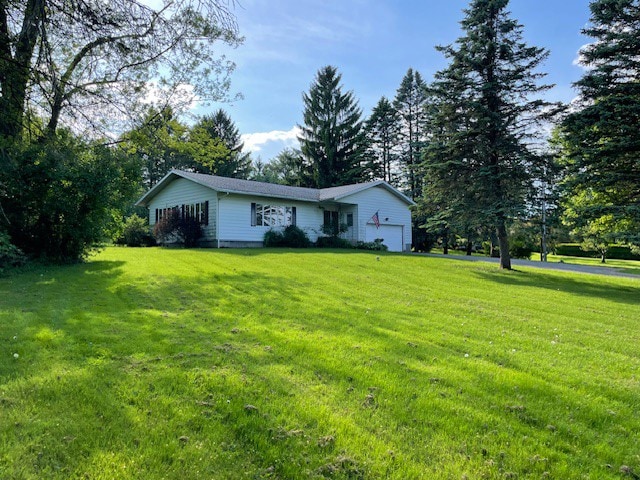 view of yard featuring a garage