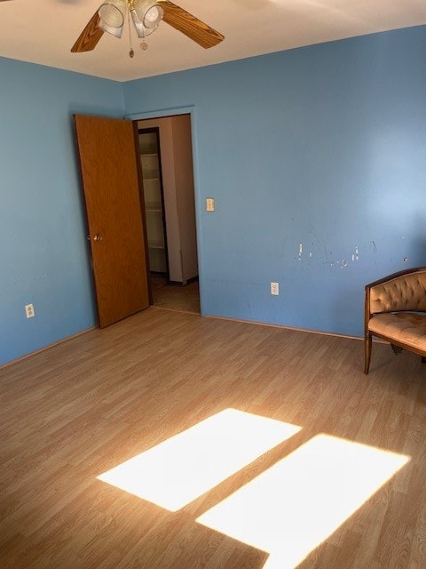 spare room with ceiling fan and hardwood / wood-style floors