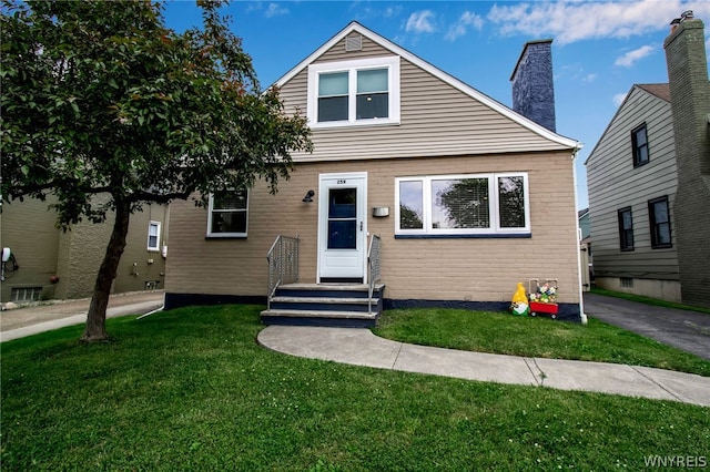 bungalow-style home featuring a front lawn