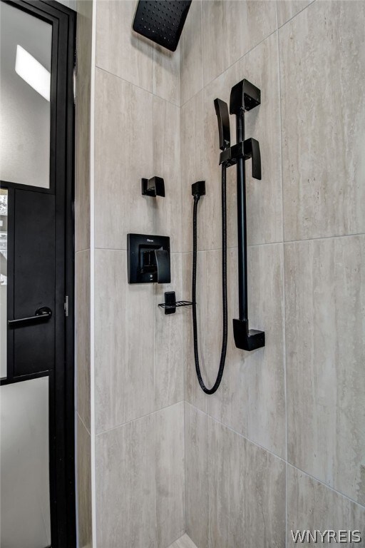 details with a tile shower