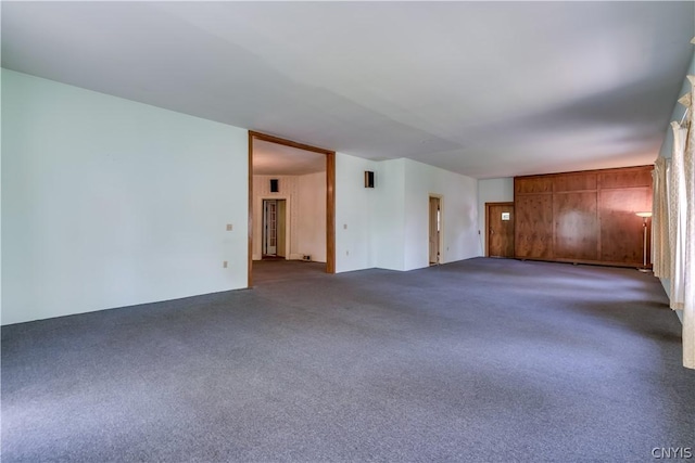 unfurnished room with carpet floors