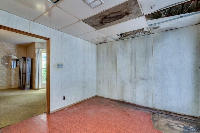 carpeted empty room with visible vents