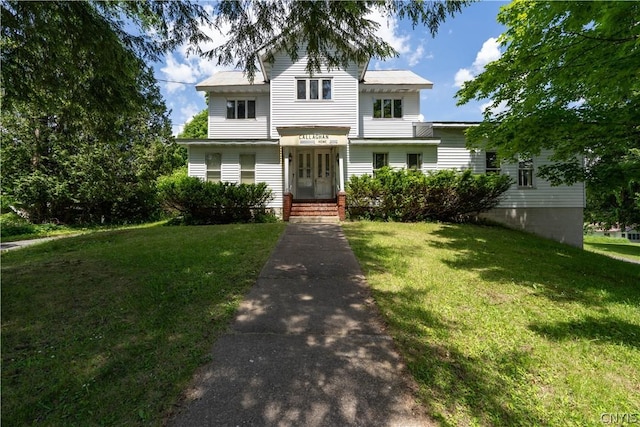 view of front of house with a front lawn