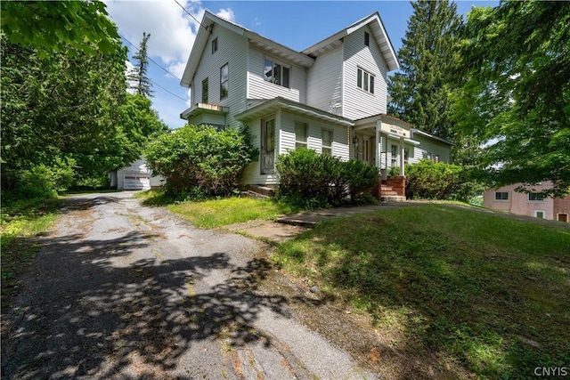 view of property exterior with a yard