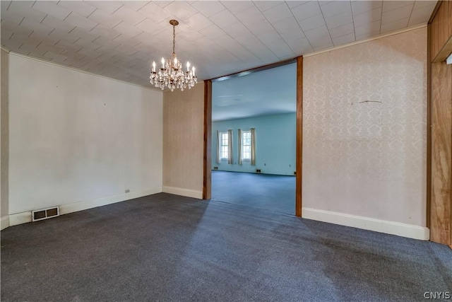unfurnished room featuring dark carpet, visible vents, baseboards, and a notable chandelier
