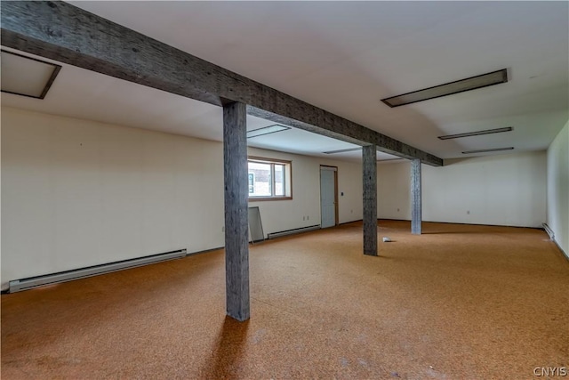 below grade area featuring carpet and baseboard heating