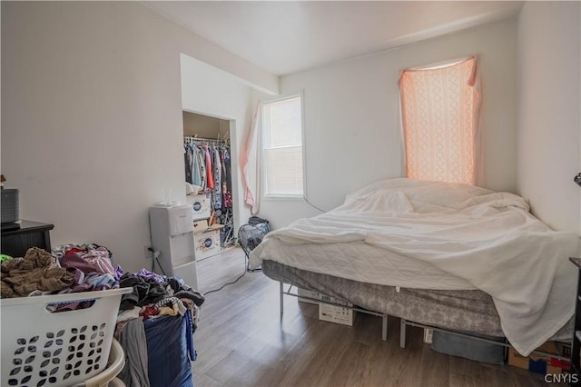 bedroom featuring a closet and hardwood / wood-style flooring