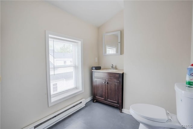 bathroom featuring baseboard heating, concrete floors, vaulted ceiling, toilet, and vanity