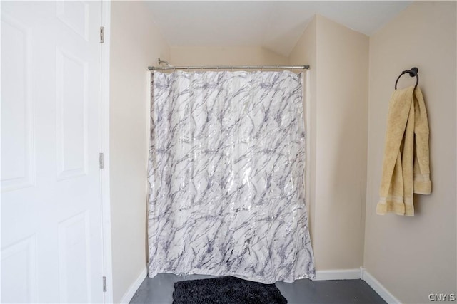 bathroom with a shower with curtain