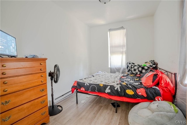 bedroom with light hardwood / wood-style floors