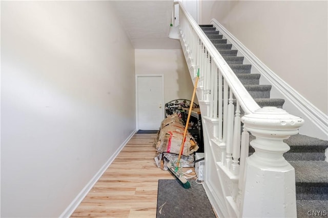 stairway featuring hardwood / wood-style floors