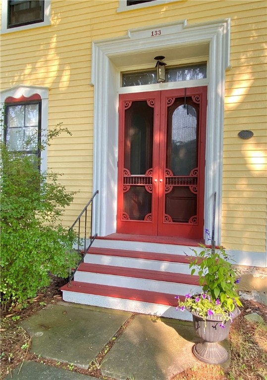 view of exterior entry featuring french doors