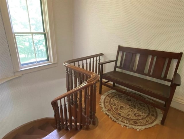 stairway with wood finished floors