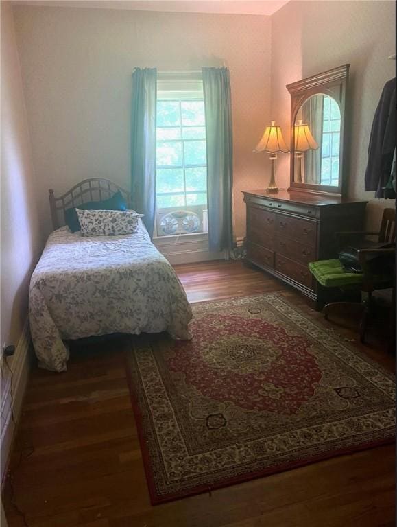 bedroom featuring wood finished floors