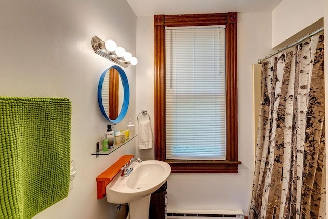 bathroom with sink and baseboard heating