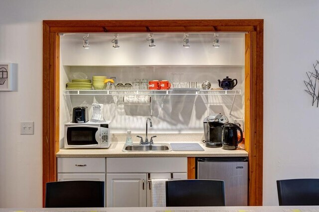 bar with fridge and sink