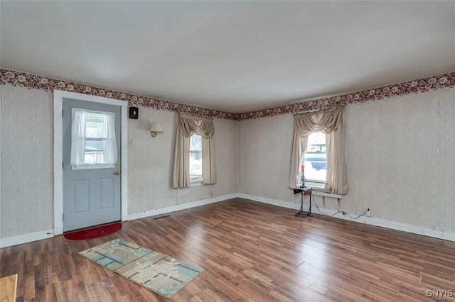 entryway with hardwood / wood-style flooring