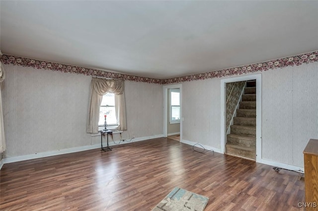 unfurnished living room with hardwood / wood-style flooring