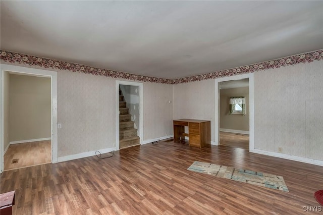 unfurnished living room with hardwood / wood-style floors