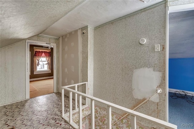 hallway featuring vaulted ceiling