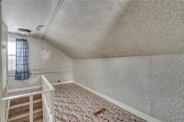 bonus room featuring vaulted ceiling