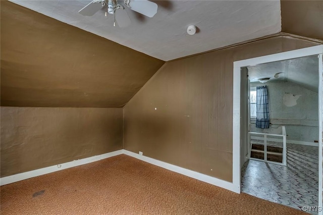 additional living space with carpet floors, vaulted ceiling, and ceiling fan