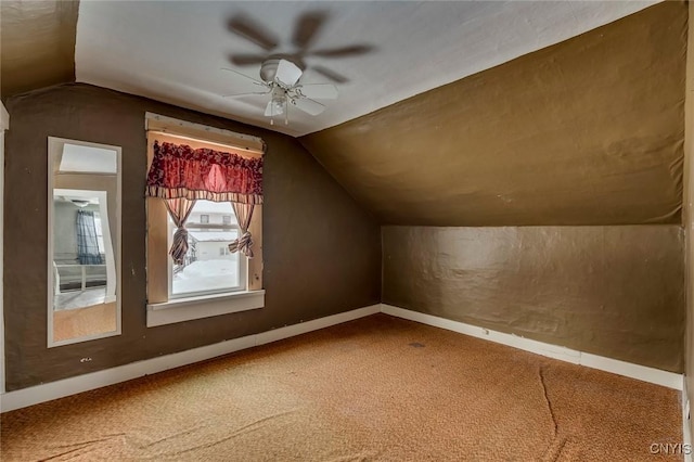 additional living space with ceiling fan, lofted ceiling, and carpet flooring