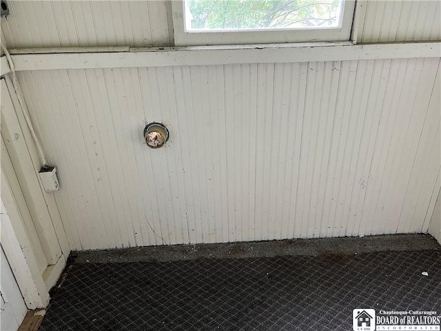 room details featuring wooden walls