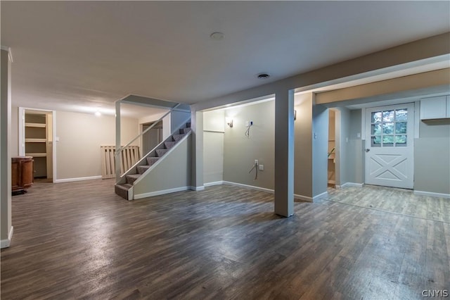 basement featuring dark hardwood / wood-style flooring