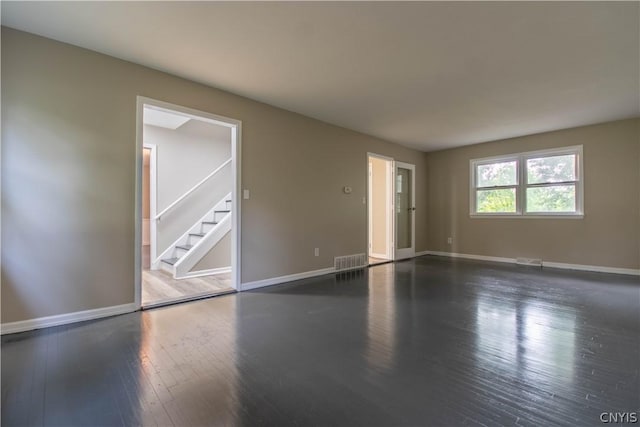 spare room featuring dark hardwood / wood-style floors