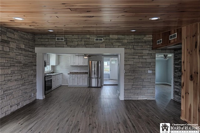 kitchen featuring wooden ceiling, stainless steel appliances, white cabinetry, and dark wood-type flooring