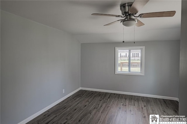 spare room featuring dark hardwood / wood-style floors, ceiling fan, and lofted ceiling