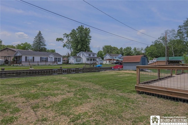 view of yard with a storage shed