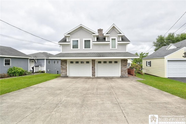 view of front of house with a garage and a front yard