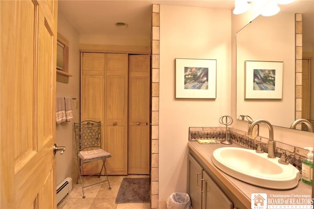 bathroom featuring vanity, tile patterned floors, and baseboard heating