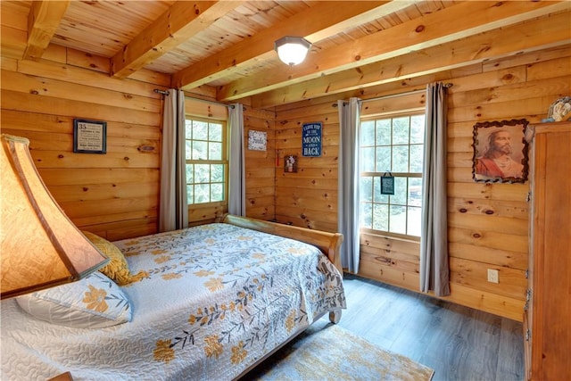 bedroom with wooden ceiling, wood walls, beamed ceiling, and wood finished floors