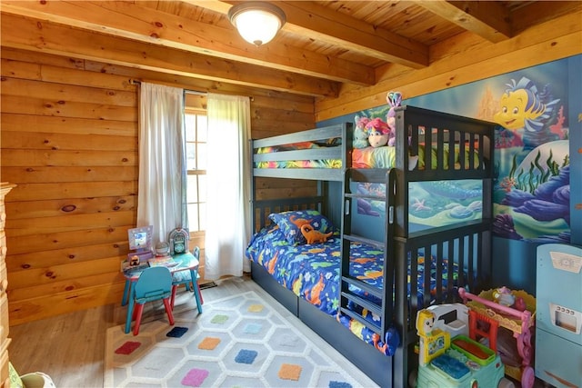 bedroom with wooden ceiling, wooden walls, beam ceiling, and wood finished floors