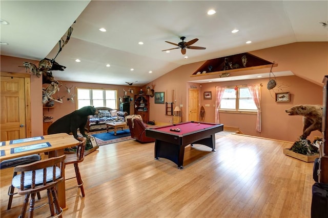 playroom with a wealth of natural light, light wood-type flooring, lofted ceiling, and recessed lighting