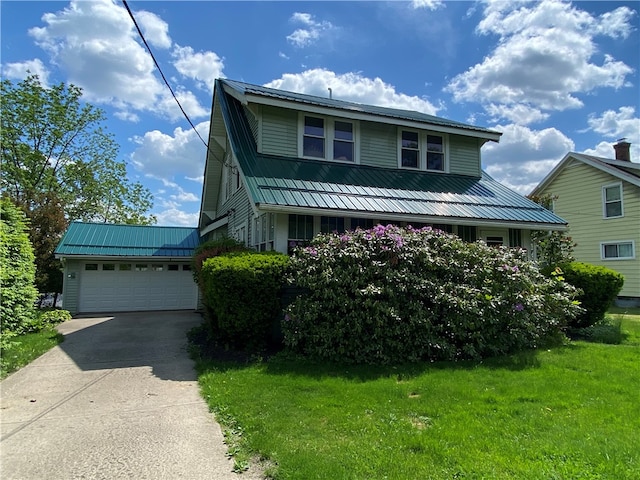 view of front of home with a garage and a front yard