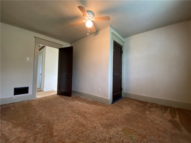 unfurnished room with ceiling fan and carpet floors