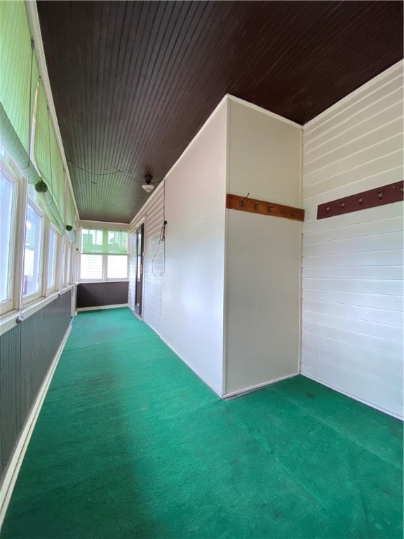 unfurnished room with wooden ceiling