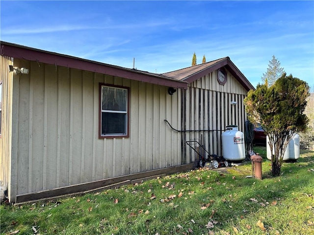 view of property exterior with a yard