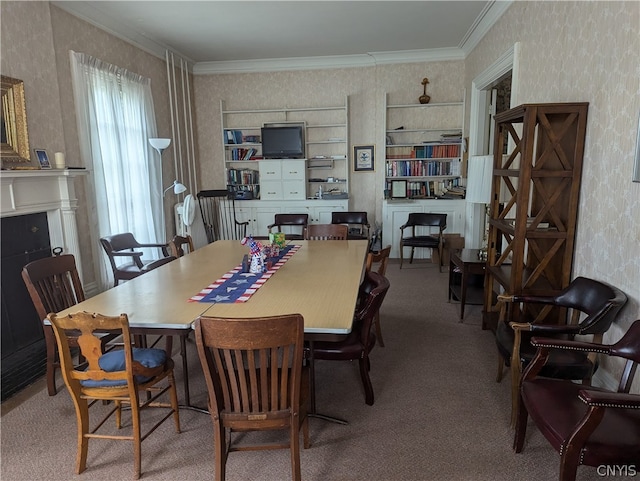 dining room with crown molding and carpet