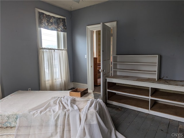 bedroom with hardwood / wood-style floors