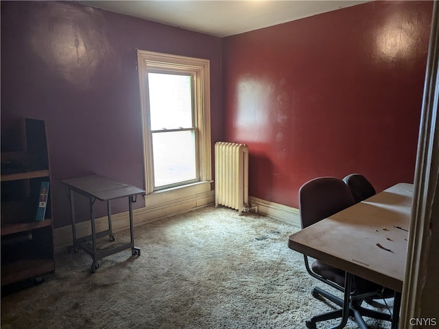 office space with carpet floors and radiator heating unit