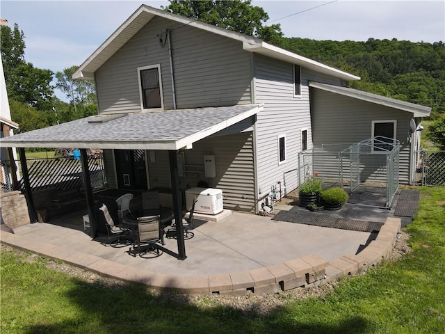 rear view of house with a patio