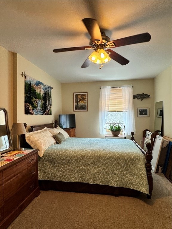 bedroom featuring ceiling fan and carpet floors